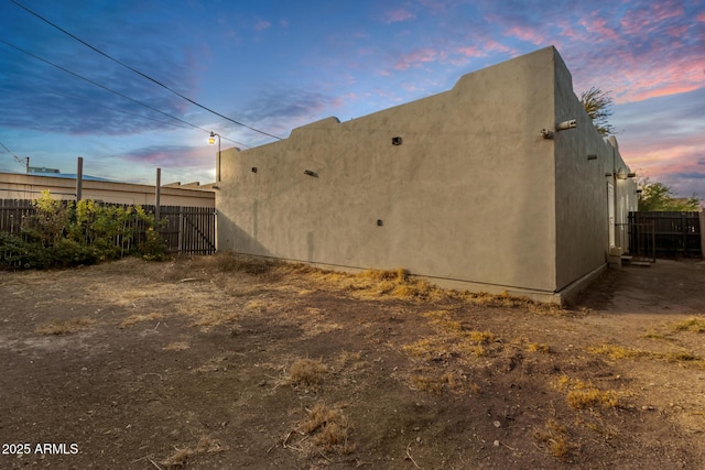 view of property exterior at dusk