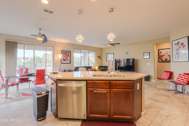 kitchen featuring stainless steel dishwasher, ceiling fan, and a healthy amount of sunlight