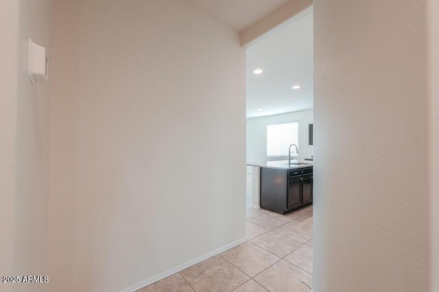 1127 E Tyler Ln, Casa Grande, AZ 85122 - corridor featuring recessed lighting, a sink, baseboards, and light tile patterned floors