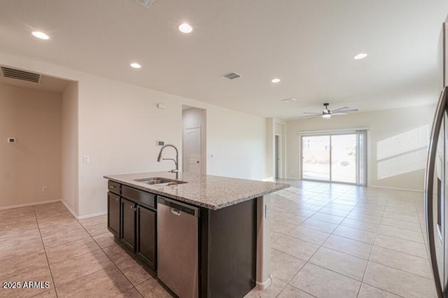 1127 E Tyler Ln, Casa Grande, AZ 85122 - kitchen with ceiling fan, visible vents, a sink, stainless steel appliances, and light tile patterned flooring