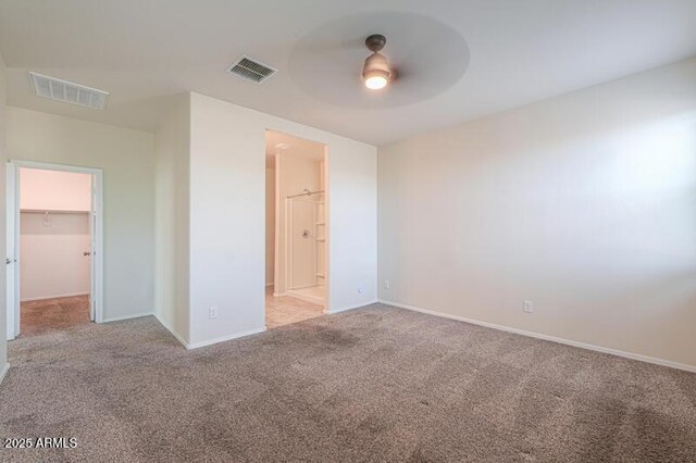 1127 E Tyler Ln, Casa Grande, AZ 85122 - unfurnished bedroom featuring carpet floors, visible vents, and a walk in closet
