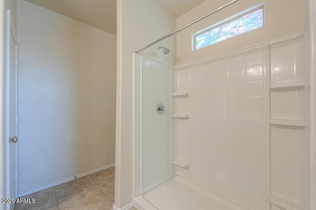 1127 E Tyler Ln, Casa Grande, AZ 85122 - bathroom with baseboards, tile patterned flooring, and a shower