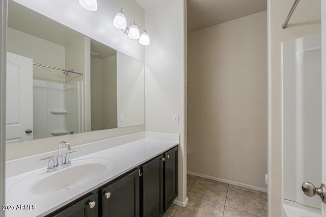 1127 E Tyler Ln, Casa Grande, AZ 85122 - full bath with tile patterned flooring, vanity, toilet, baseboards, and a shower