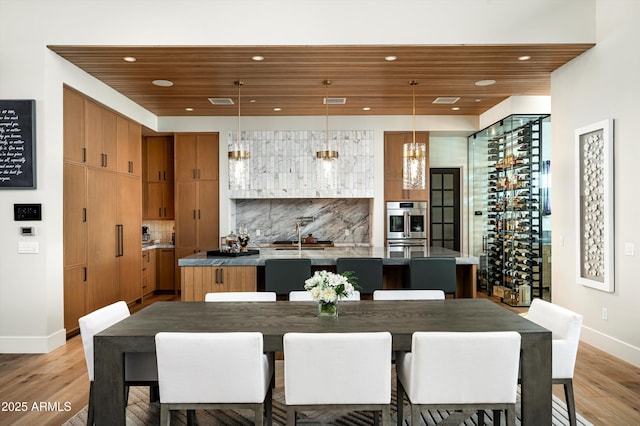 8328 E Whisper Rock Trl, Scottsdale, AZ 85266 - dining space featuring recessed lighting, wood ceiling, light wood-style flooring, and baseboards