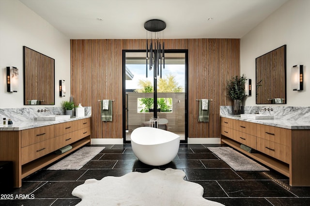 8328 E Whisper Rock Trl, Scottsdale, AZ 85266 - full bath with a freestanding bath, two vanities, and a sink