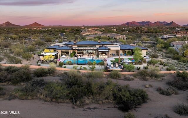 8328 E Whisper Rock Trl, Scottsdale, AZ 85266 - aerial view at dusk featuring a mountain view