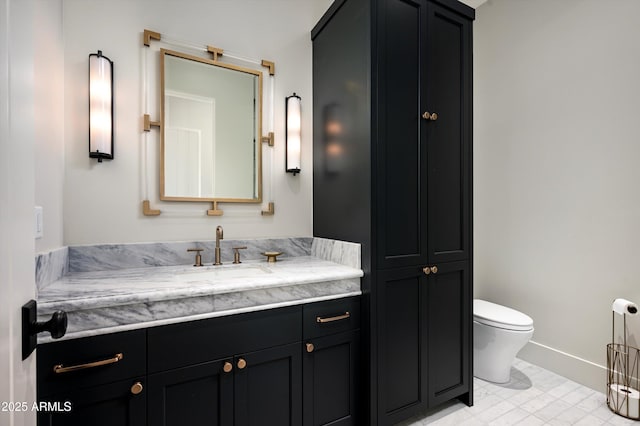 8328 E Whisper Rock Trl, Scottsdale, AZ 85266 - bathroom featuring toilet, vanity, and baseboards
