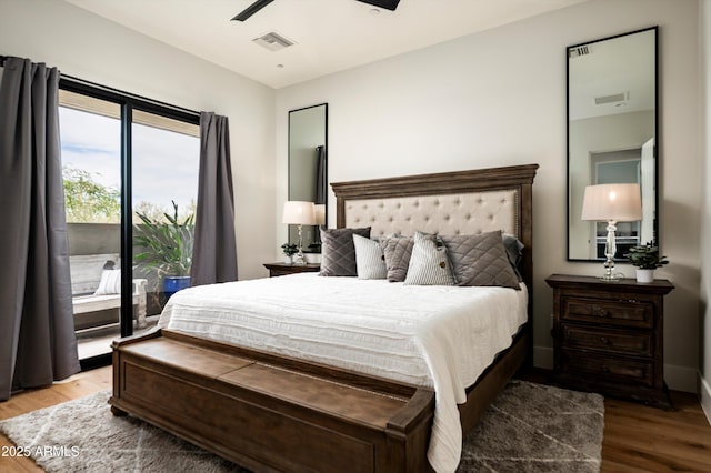 8328 E Whisper Rock Trl, Scottsdale, AZ 85266 - bedroom with wood finished floors, visible vents, a ceiling fan, and access to outside
