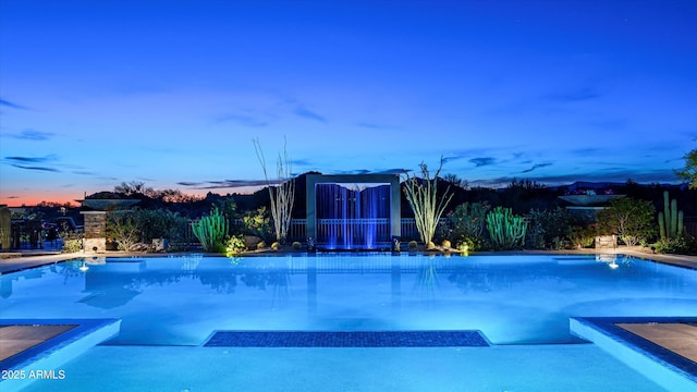 8328 E Whisper Rock Trl, Scottsdale, AZ 85266 - pool at dusk featuring an outdoor pool