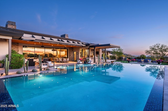 8328 E Whisper Rock Trl, Scottsdale, AZ 85266 - pool with an outdoor hangout area and a patio