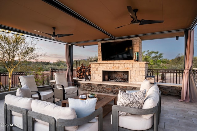8328 E Whisper Rock Trl, Scottsdale, AZ 85266 - view of patio with a ceiling fan and an outdoor living space with a fireplace