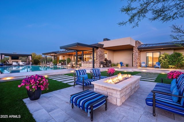 8328 E Whisper Rock Trl, Scottsdale, AZ 85266 - view of patio / terrace with an outdoor living space with a fire pit and an outdoor pool