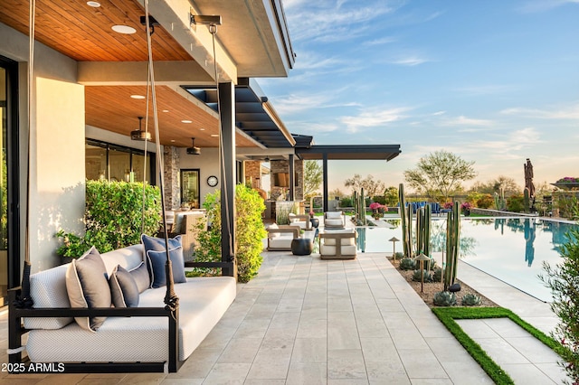8328 E Whisper Rock Trl, Scottsdale, AZ 85266 - view of patio with an outdoor hangout area, a ceiling fan, and a community pool