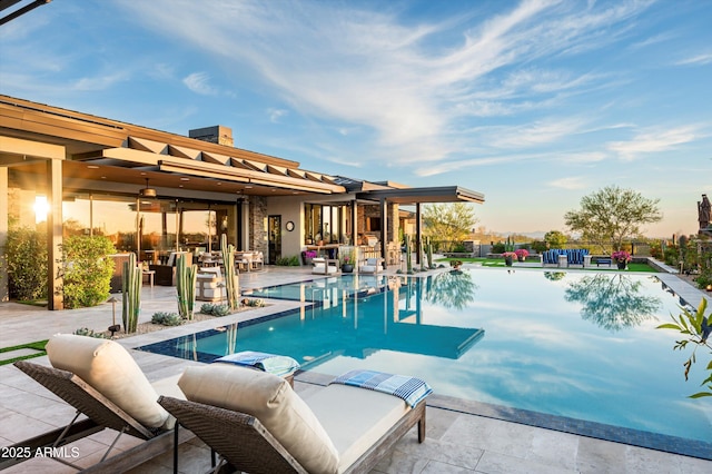 8328 E Whisper Rock Trl, Scottsdale, AZ 85266 - pool at dusk with a patio and an outdoor pool