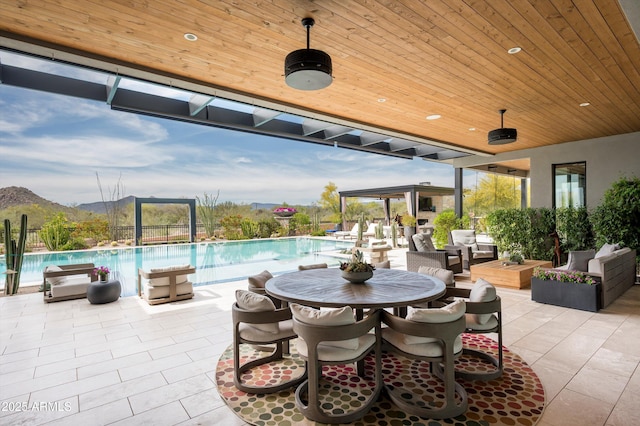 8328 E Whisper Rock Trl, Scottsdale, AZ 85266 - view of patio featuring outdoor lounge area, a mountain view, and a community pool