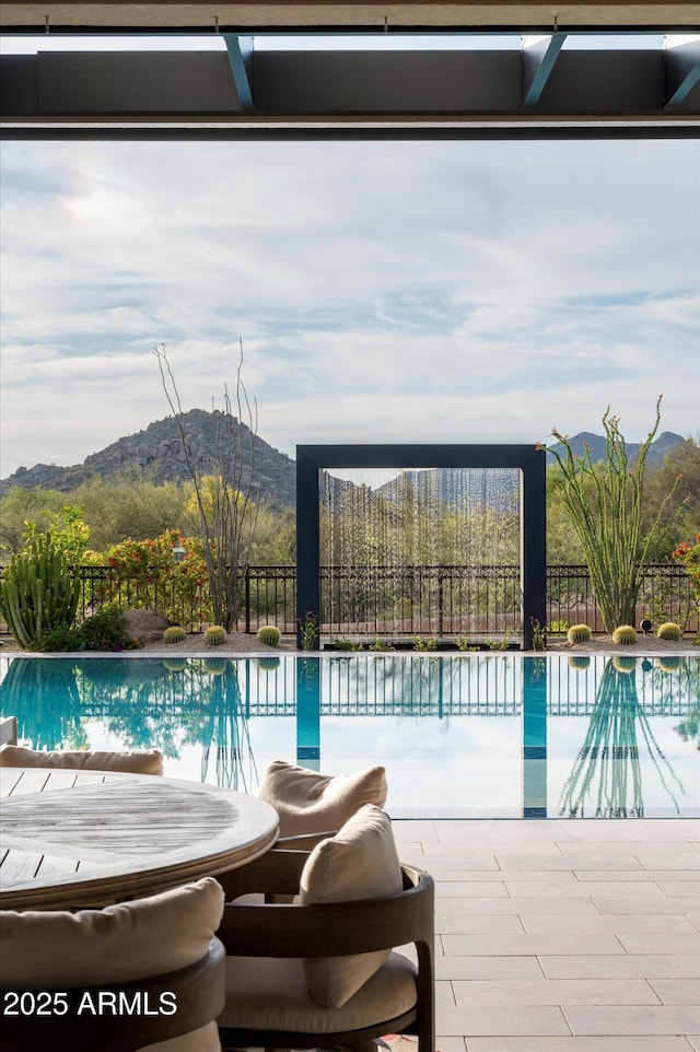8328 E Whisper Rock Trl, Scottsdale, AZ 85266 - view of swimming pool with a mountain view, fence, and an infinity pool