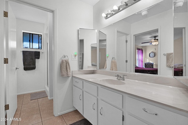 bathroom featuring tile patterned flooring, vanity, ceiling fan, and an enclosed shower