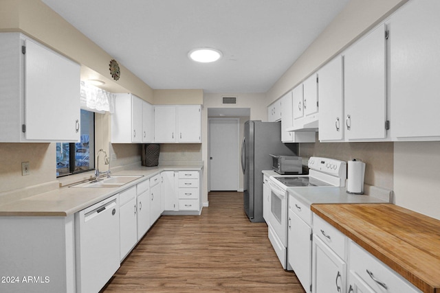 kitchen featuring white cabinets, light wood-type flooring, white appliances, and sink