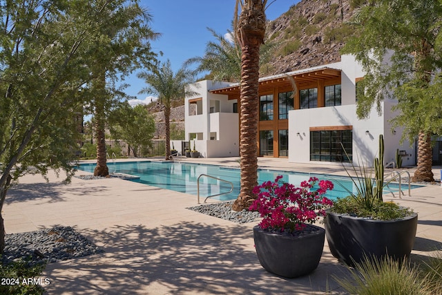 view of pool featuring a patio area