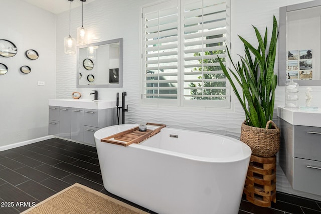 bathroom featuring a tub to relax in and vanity