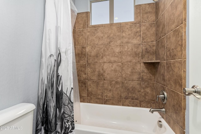 bathroom with shower / bathtub combination with curtain and toilet