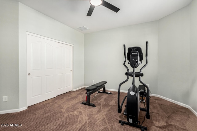 exercise room featuring ceiling fan and carpet