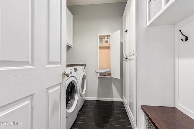 laundry area with cabinets and separate washer and dryer