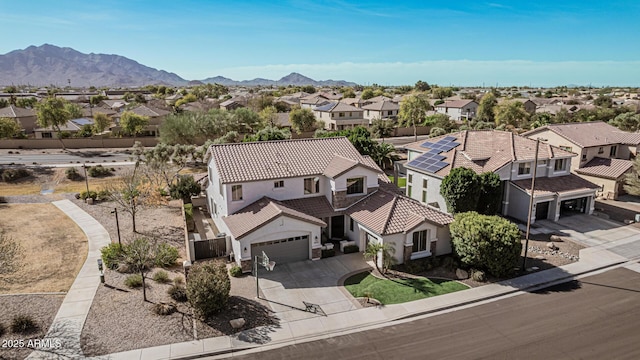 birds eye view of property featuring a mountain view