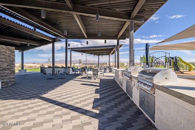 1205 W Sparrow Dr, Queen Creek, AZ 85140 - view of patio / terrace with a grill, exterior kitchen, and outdoor dining space