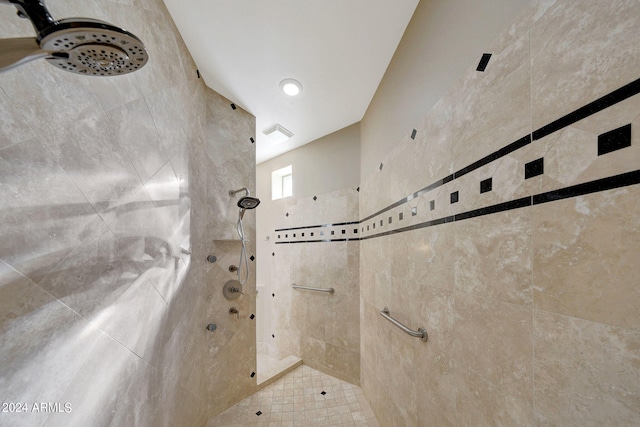 bathroom featuring tiled shower