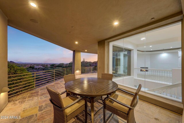 unfurnished room with ceiling fan, a mountain view, and light hardwood / wood-style flooring