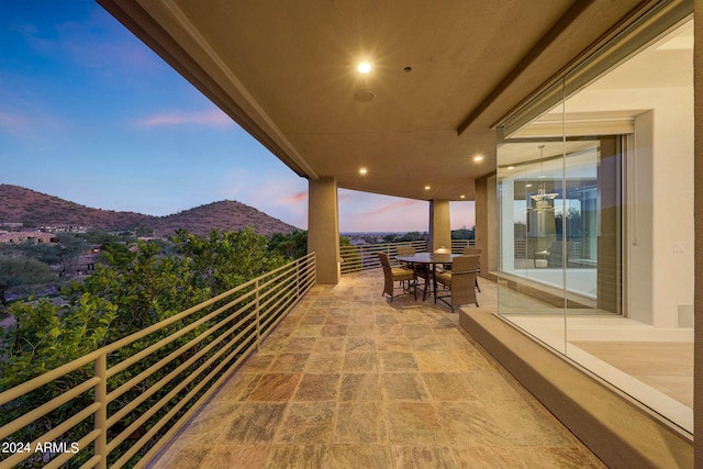 balcony at dusk with a mountain view