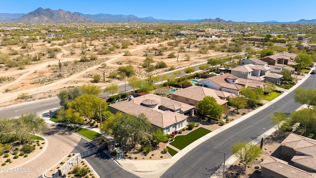 birds eye view of property with a residential view and a mountain view