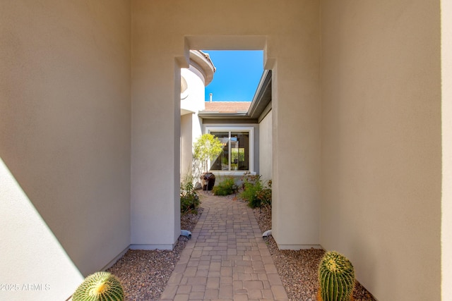 view of side of property with stucco siding