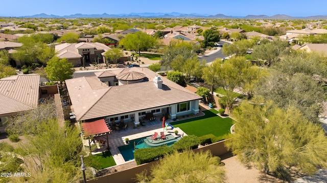 birds eye view of property with a mountain view and a residential view