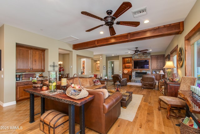 living room featuring recessed lighting, visible vents, beam ceiling, a fireplace, and ceiling fan