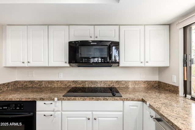 kitchen featuring white cabinets, black appliances, and dark countertops