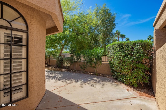 view of patio / terrace featuring fence