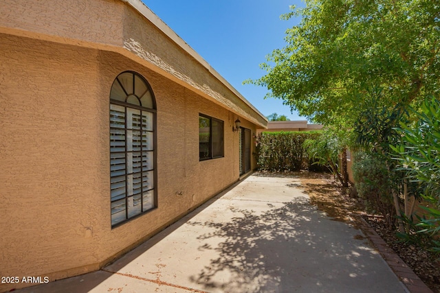 6313 E Aire Libre Ln, Scottsdale, AZ 85254 - view of property exterior with a patio and stucco siding
