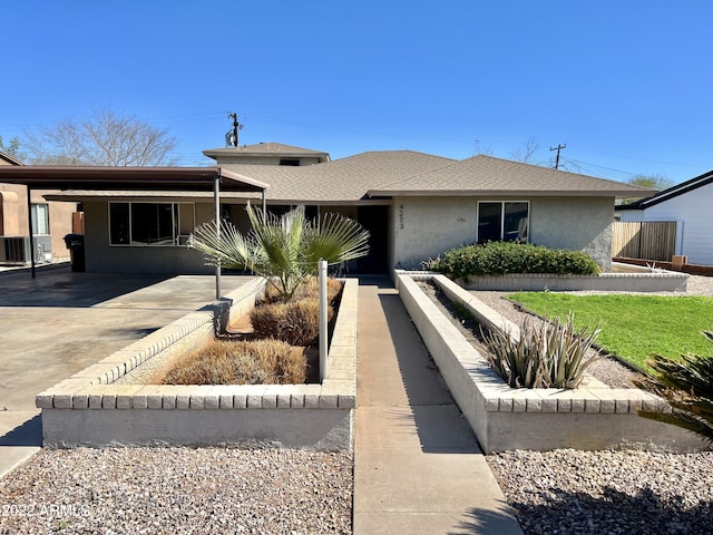 4213 N Westview Dr, Phoenix, AZ 85015 - ranch-style home with stucco siding, a carport, concrete driveway, and central AC unit