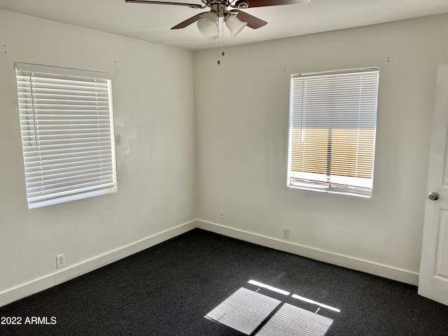 4213 N Westview Dr, Phoenix, AZ 85015 - empty room with a ceiling fan, baseboards, and dark colored carpet