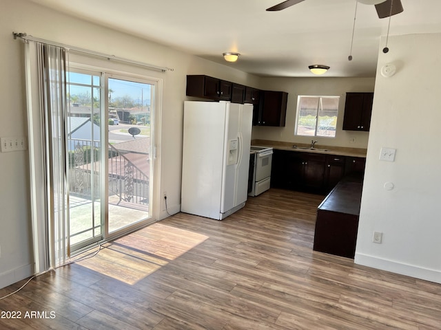4213 N Westview Dr, Phoenix, AZ 85015 - kitchen featuring white appliances, a sink, wood finished floors, a ceiling fan, and baseboards