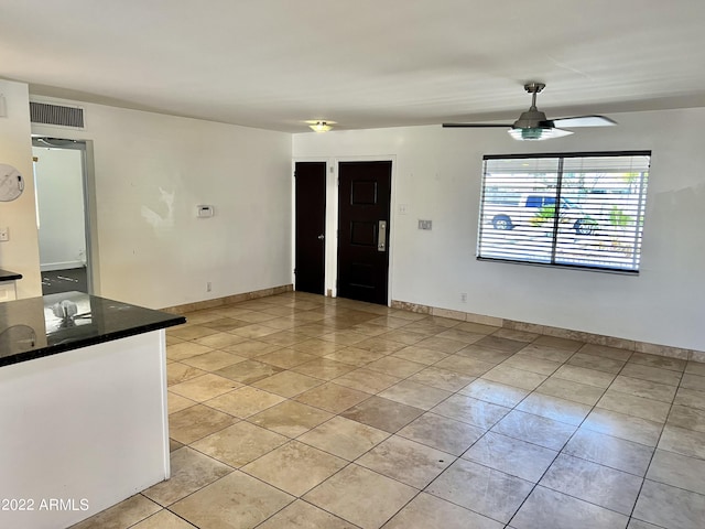 4213 N Westview Dr, Phoenix, AZ 85015 - unfurnished room featuring light tile patterned floors, ceiling fan, and baseboards