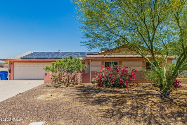 4501 N 60th Ave, Phoenix, AZ 85033 - ranch-style house featuring a garage, solar panels, and driveway