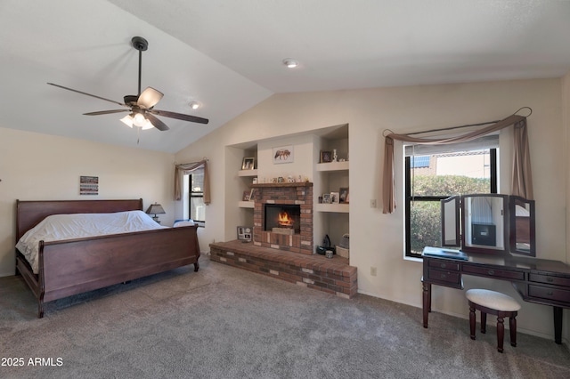 bedroom with vaulted ceiling, carpet floors, a fireplace, ceiling fan, and baseboards