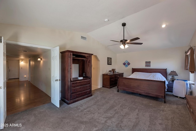 bedroom featuring vaulted ceiling, carpet flooring, and ceiling fan