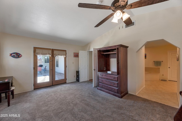 living area featuring french doors, carpet, a ceiling fan, baseboards, and high vaulted ceiling
