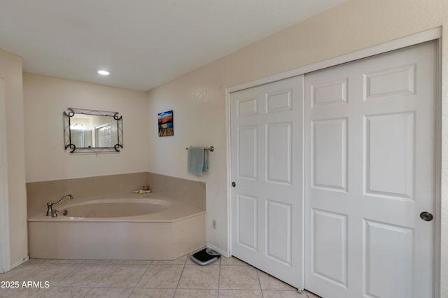 bathroom featuring a bath, tile patterned flooring, and recessed lighting