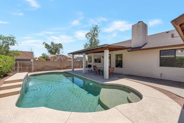 view of swimming pool with a fenced backyard and a patio area