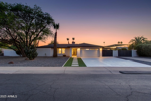 14012 N 57th Pl, Scottsdale, AZ 85254 - view of front of house with driveway, a garage, and stucco siding